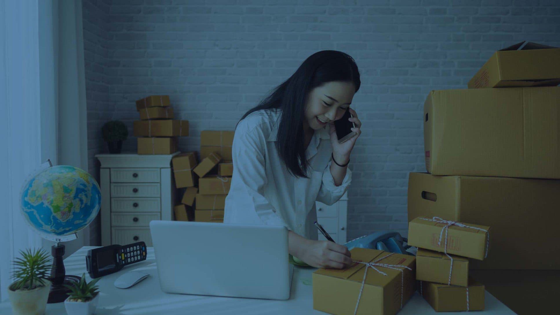 Business owner wrapping gift shipments