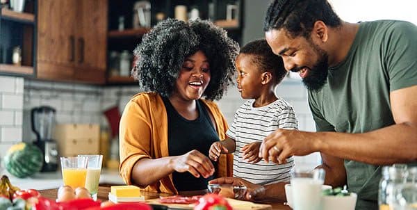 Family has fun together in the kitchen