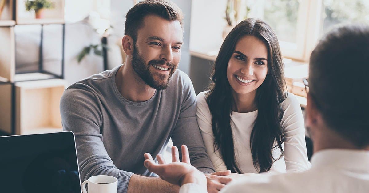 Happy couple discovers the advantages of personal financial planning