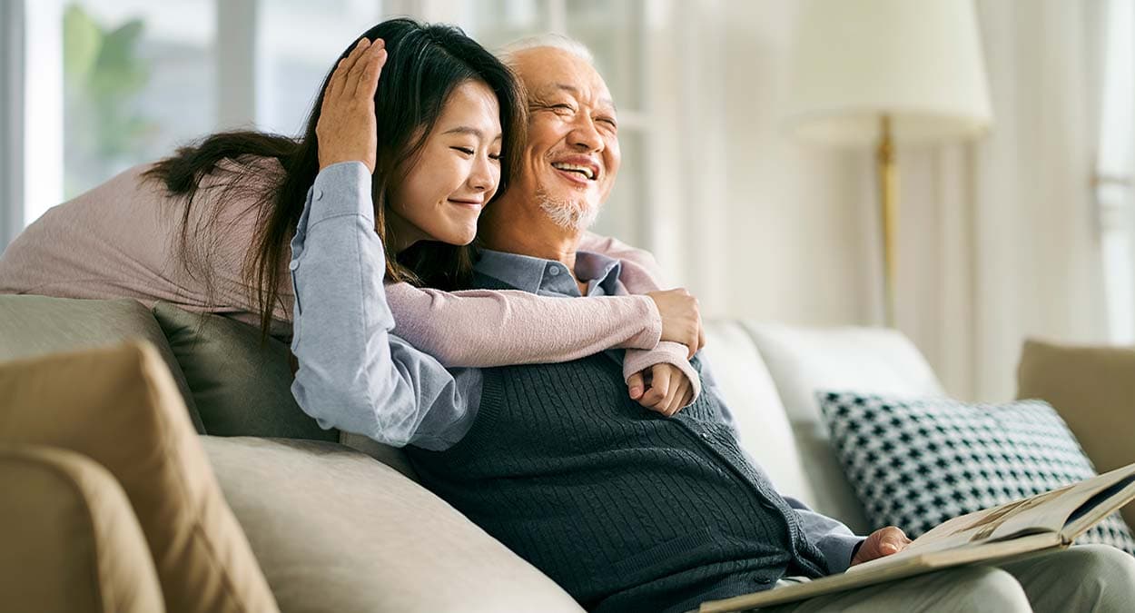 elderly father and adult daughter hanging out