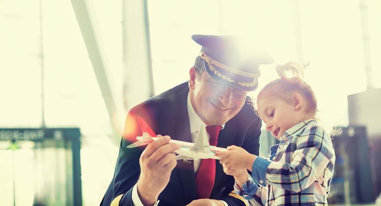 Airline pilot going through divorce plays with child