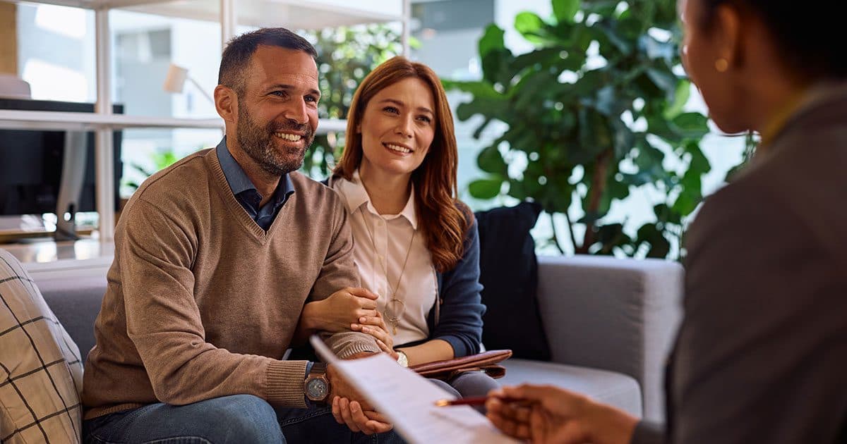 High-net-worth investor in business suit meeting with financial advisor to discuss private credit investment opportunities