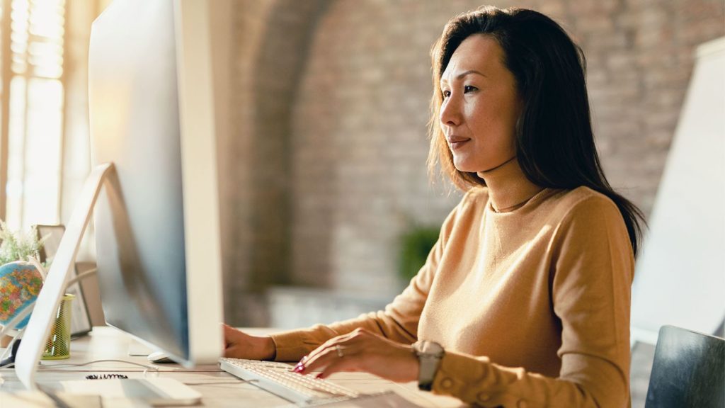 Businesswoman working on a computer.