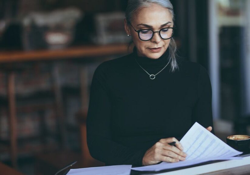 Woman reviewing financial planning documents.