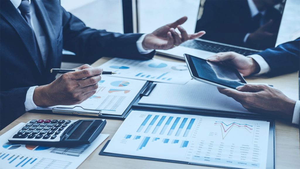 Two men reviewing numbers in meeting