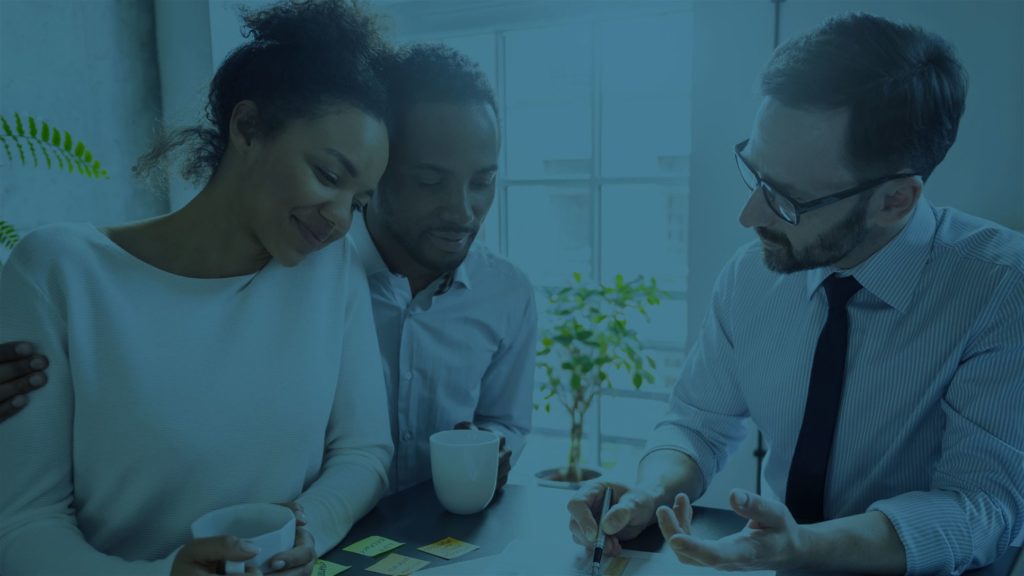 Couple reviewing policy with advisor