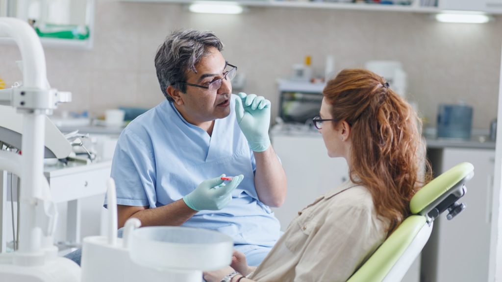 Dentist with patient