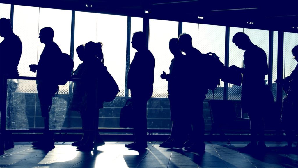 Passengers in line waiting to board plane