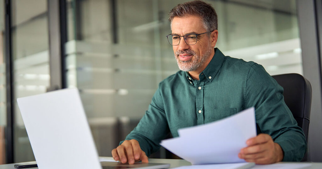 Business owner filing reports in office