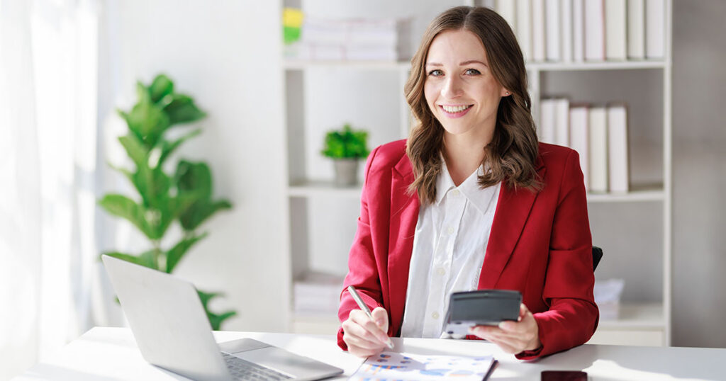 Business owner doing taxes at desk
