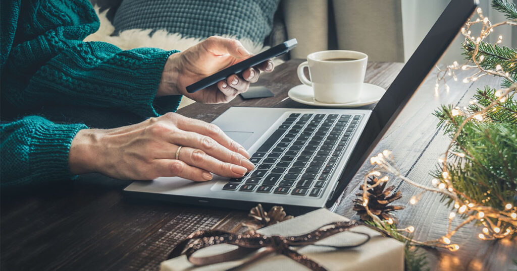 Business owner holiday shopping on computer
