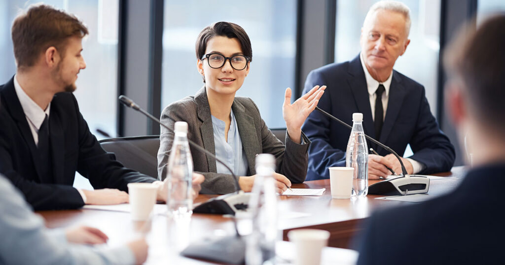 Woman speaking during nonprofit board meeting