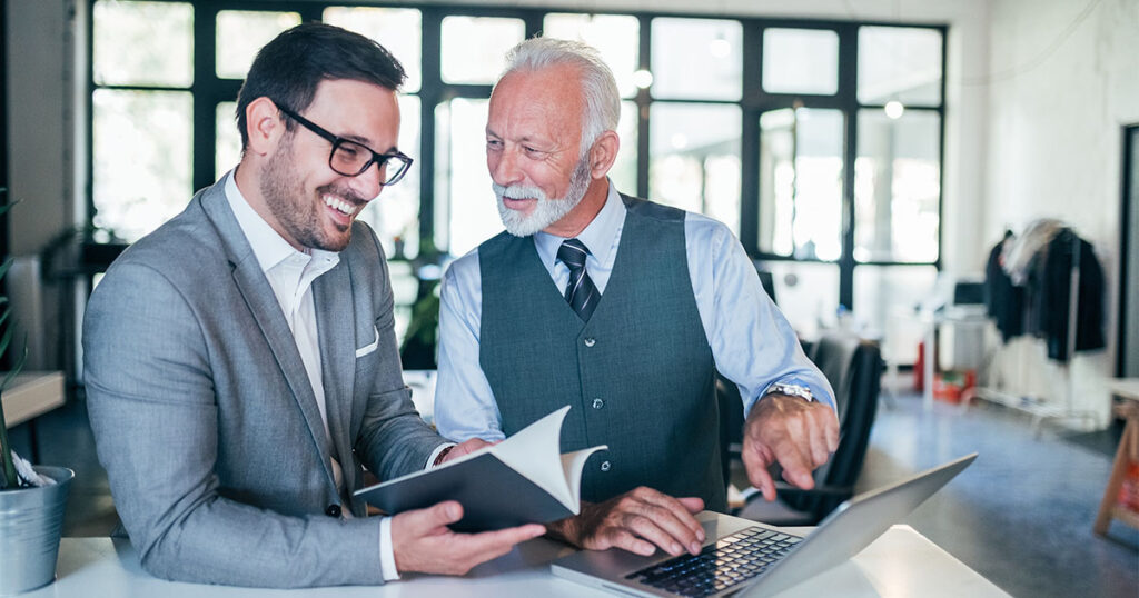Business owner going over succession plan with colleague