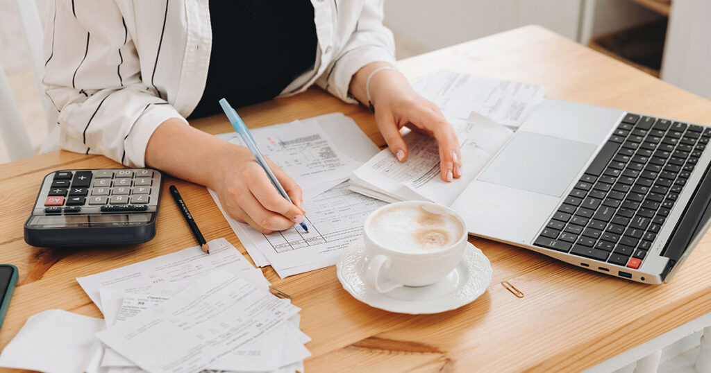 Taxpayer reviewing tax documents at her desk