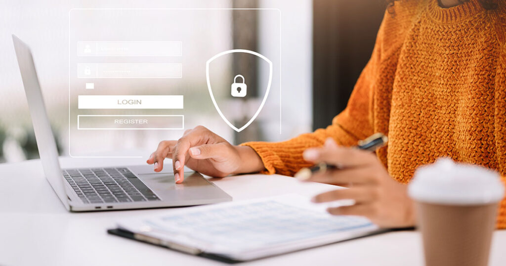 Employee practicing cybersecurity training by using a strong password to lock her work computer