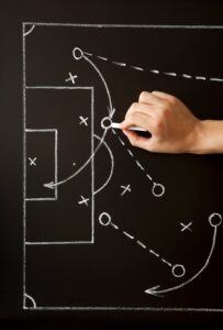 Man drawing a soccer game strategy