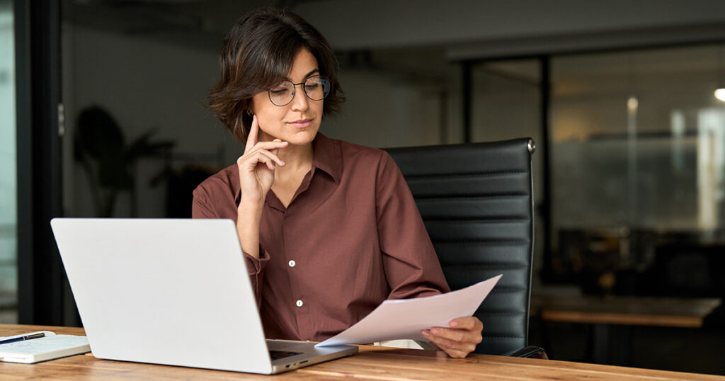 Business executive reads about structured notes