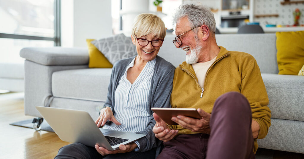 Senior couple looks up Social Security information online