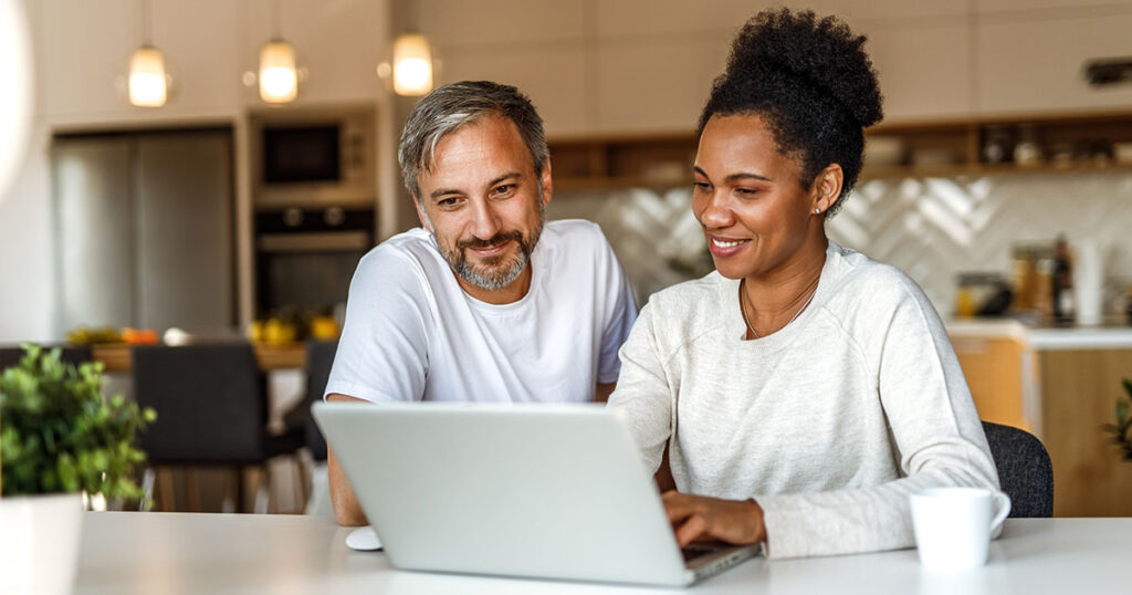 Couple evaluates their investment portfolio