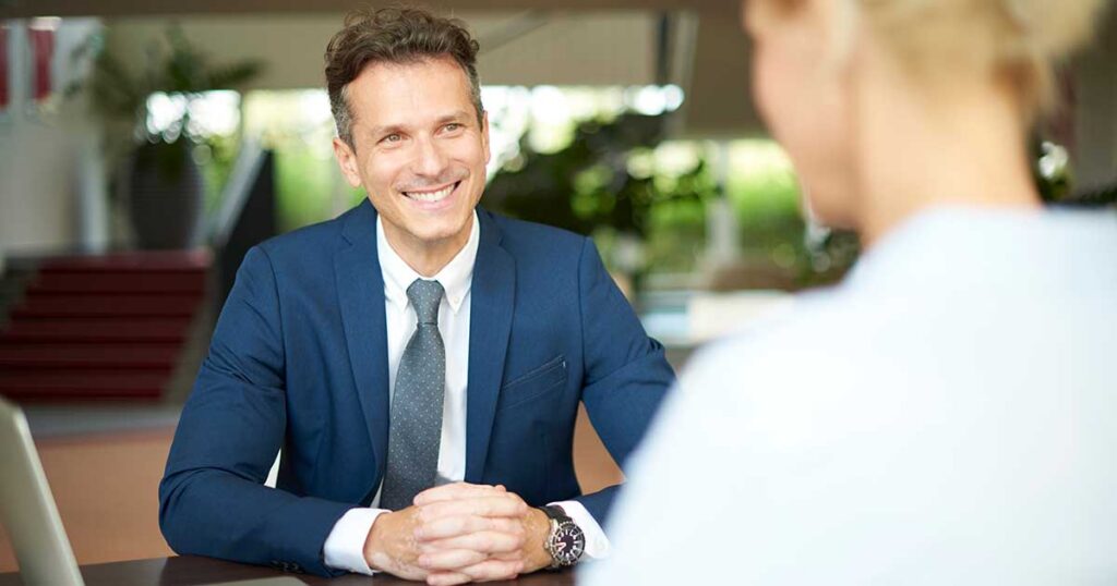 Wealth advisor meeting with a client to discuss legal asset protection strategies to help safeguard family wealth from lawsuits and creditors
