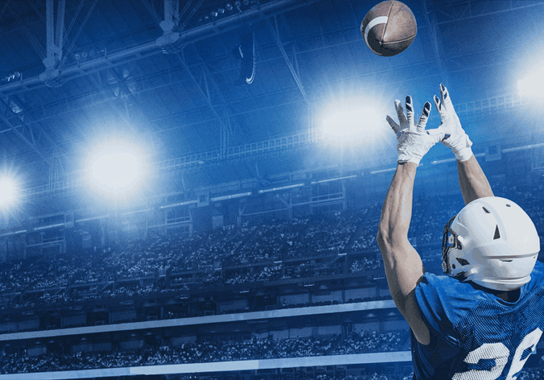 Football player catching football