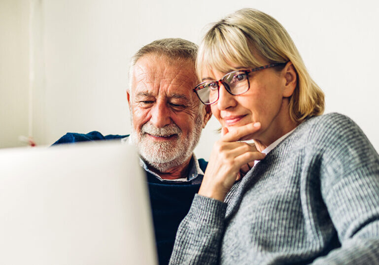 Man and Woman looking at laptop