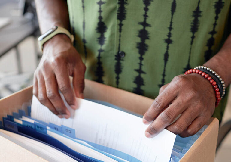 Man Goes Through Files to Take Care of Financial Matters After Losing His Home