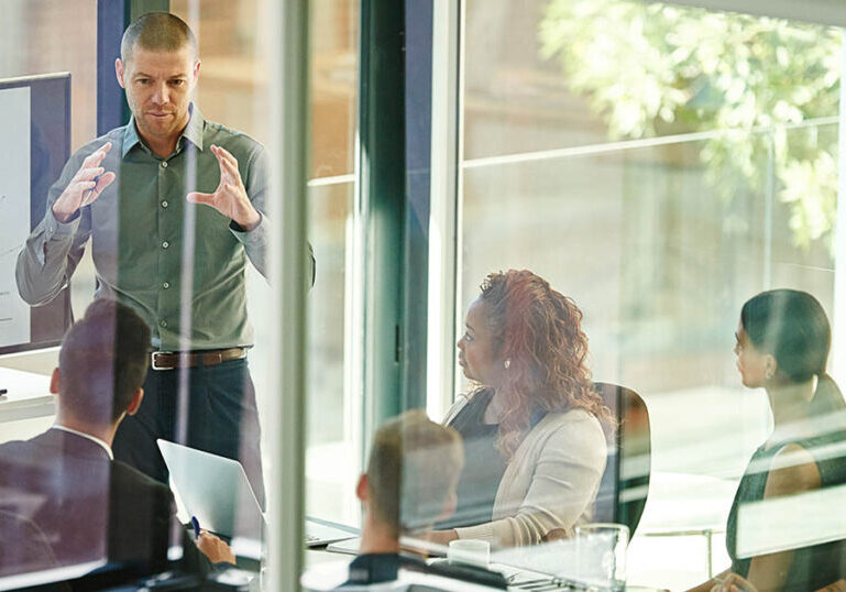 Business people, tech or advice in boardroom for training, productivity report or feedback chart on screen. Speaker, team or corporate presentation in office for company growth with brand management.