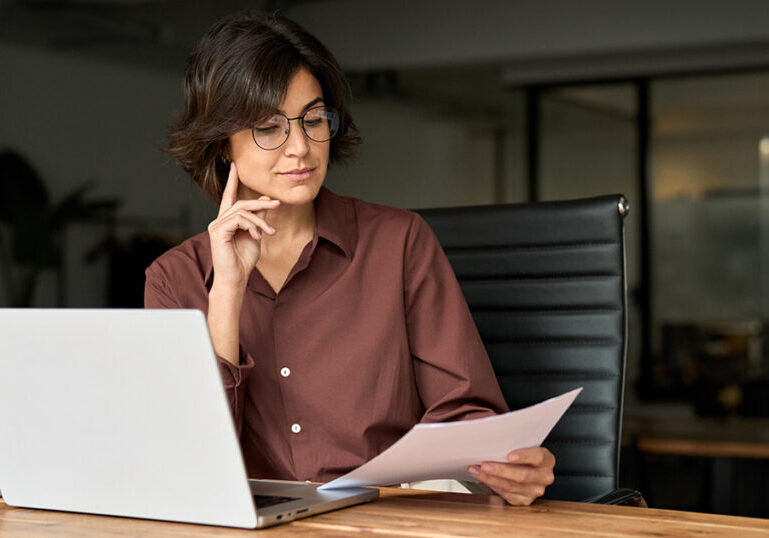 Business executive reads about structured notes