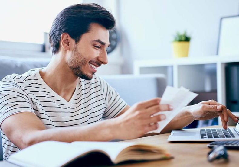 Young adult working on his budget and financial planning