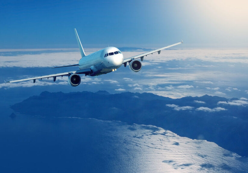 Plane flying over clouds