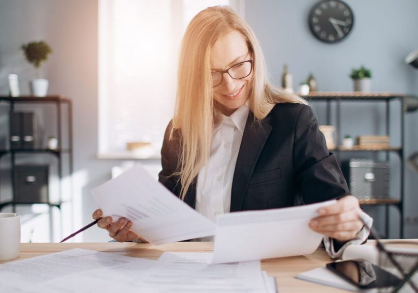 Business owner reviews the seven documents she needs