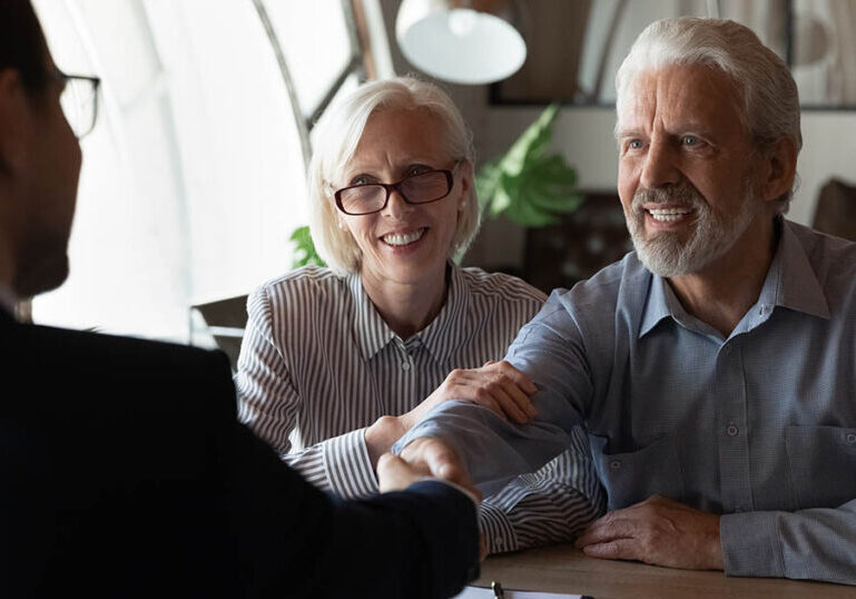 mature couple sits down with lawyer to create an intentionally defective grantor trust