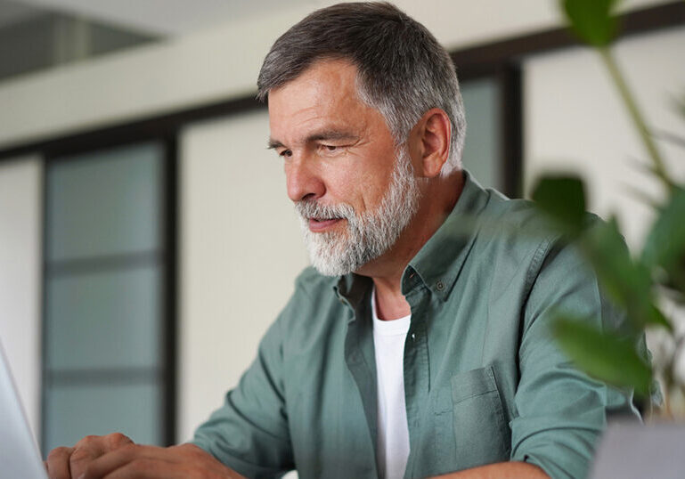Man researches how to prepare finances for a natural disaster