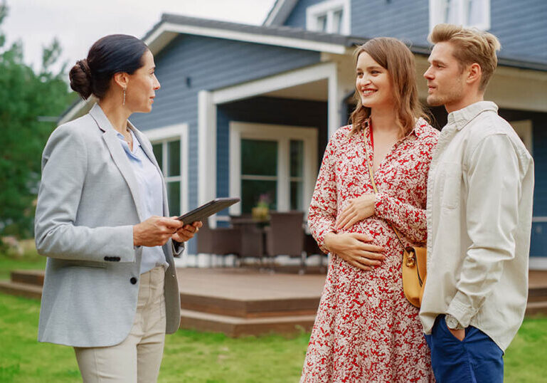 A couple considers whether they should buy a home now or wait