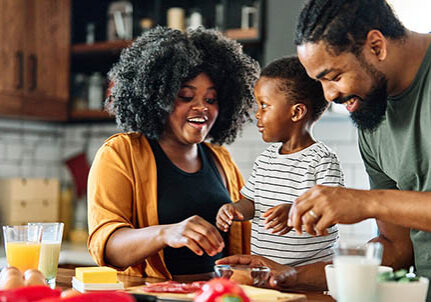Family has fun together in the kitchen