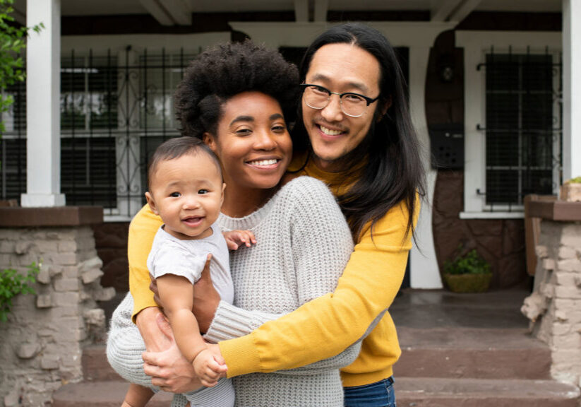 Cute multiethnic family standing at the porch during covid19 lockdown