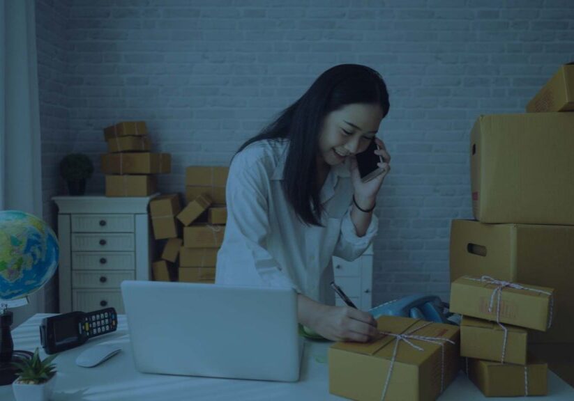 Business owner wrapping gift shipments