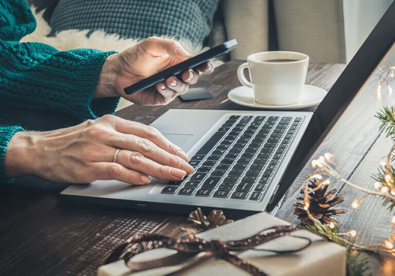 Business owner holiday shopping on computer