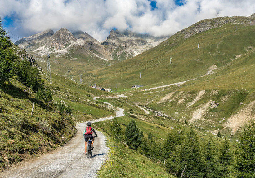 active senior woman, riding her e-mountainbike on the famous Suv
