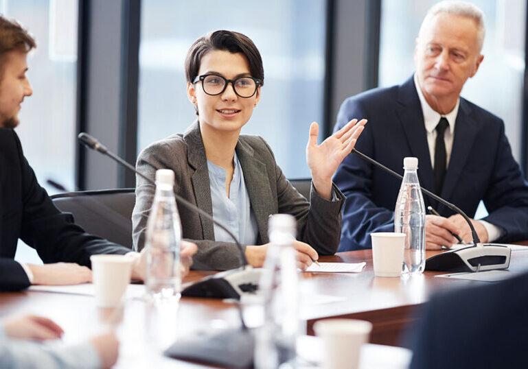 Woman speaking during nonprofit board meeting
