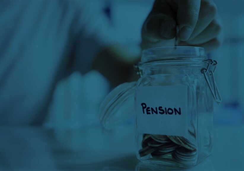 Hand putting coins in jar to save money for pension