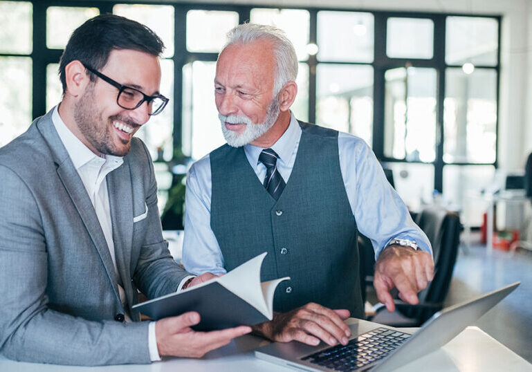 Business owner going over succession plan with colleague