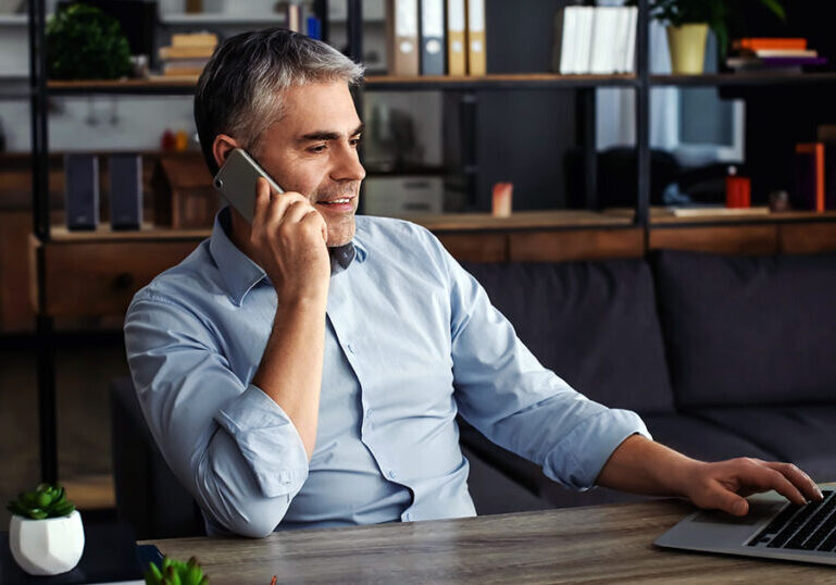 business owner on phone in office