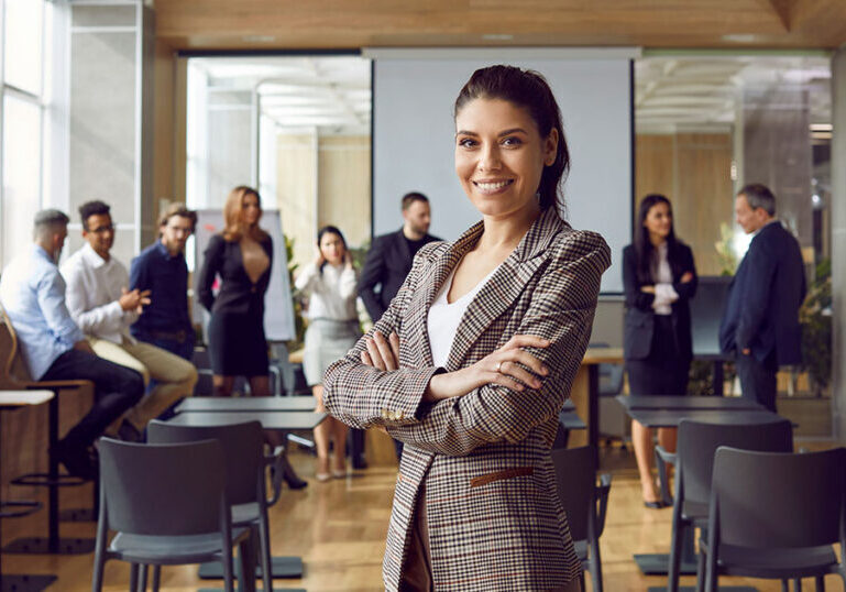 Business leader instructing a leadership training for her peers in the office